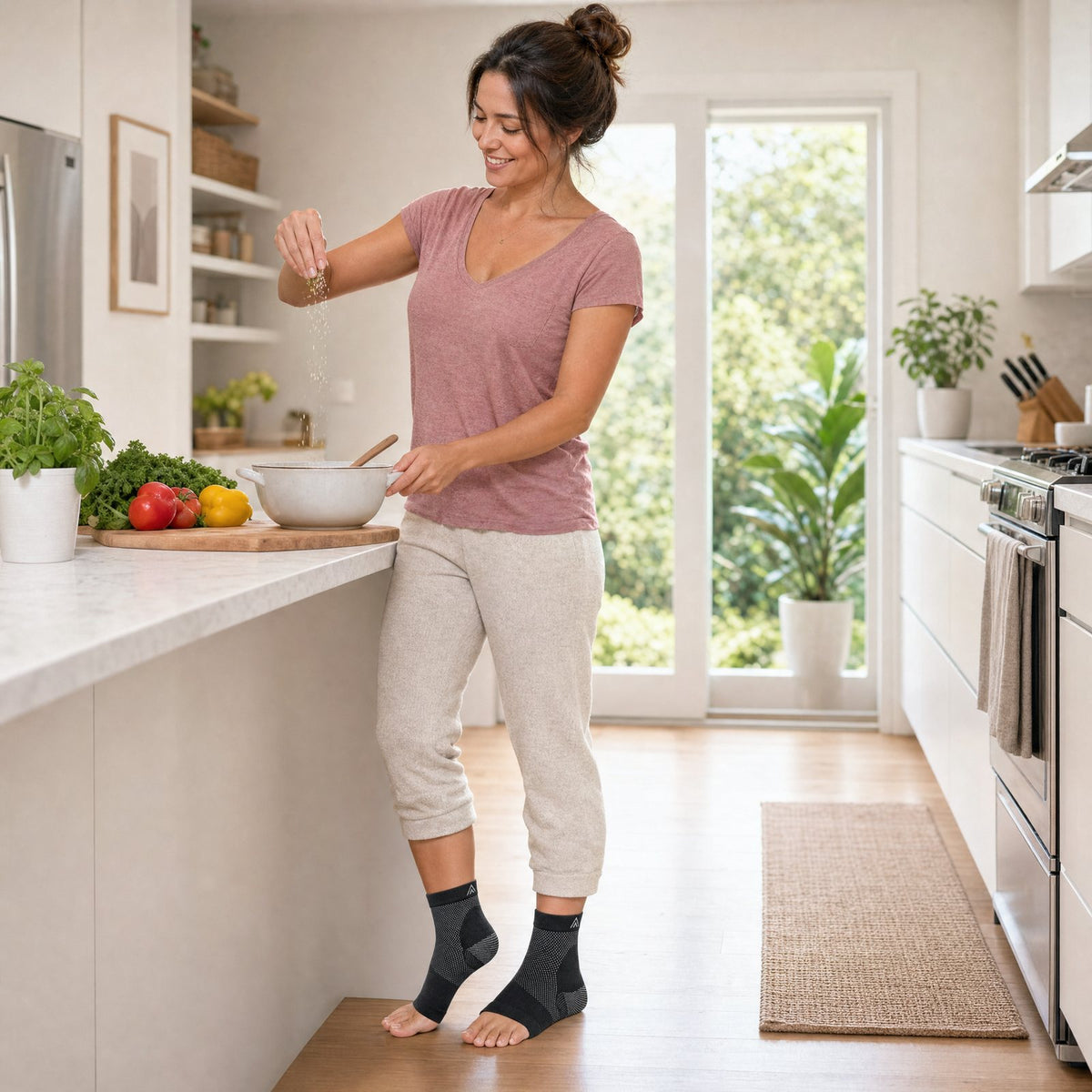 Woman wearing MoveComforts footsleeves at home